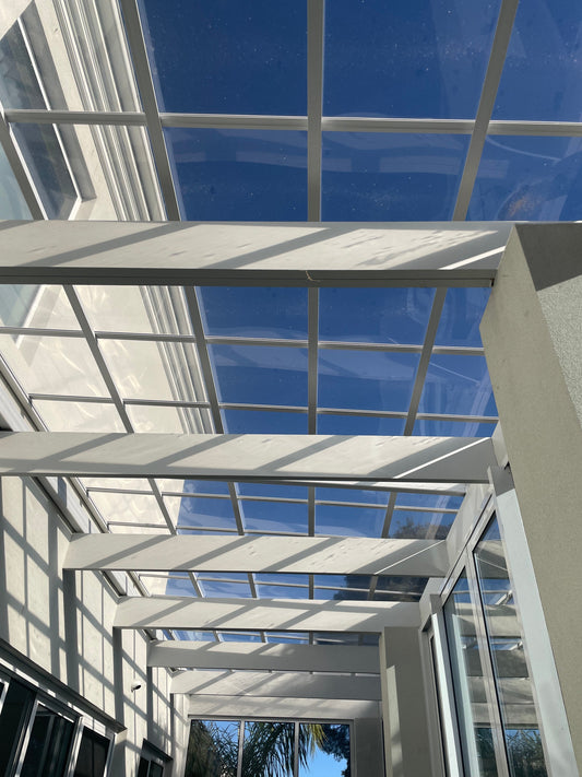 Polycarbonate Roofing vs Colorbond Roofing: Which Is Better for Australian Pergolas and Patios?